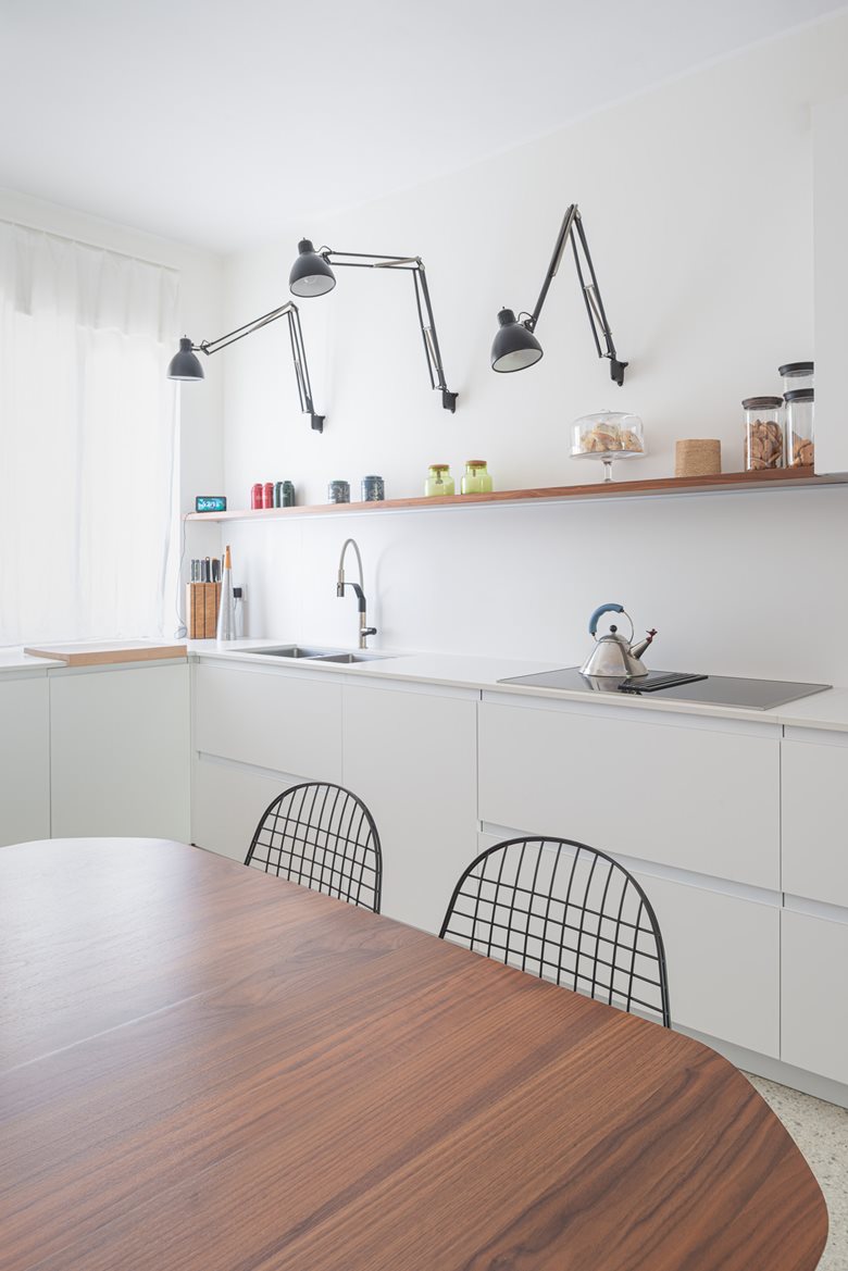 Grey kitchen cabinets against sage green walls in an attic apartment - COCO  LAPINE DESIGNCOCO LAPINE DESIGN