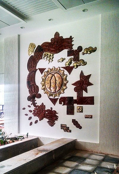 terracotta and copper wall murals at Mana Projects Bangalore.